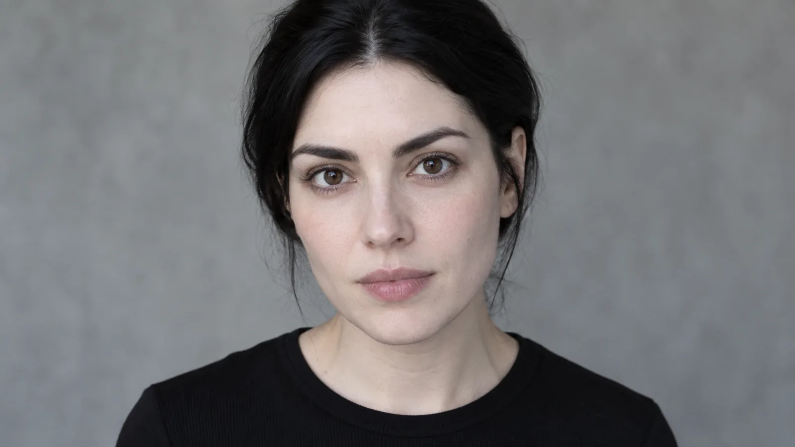 Pale deep winter coloring: porcelain cool skin, near-black hair and dark brown eyes in soft daylight